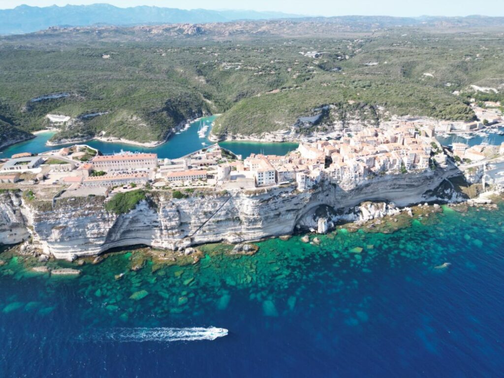 Corsica Itinerary: 2-Week Road Trip by Campervan (2026) Bonifacio on Corsica: old town on white limestone cliffs above the sea